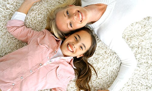 mother-and-daughter-lying-on-floor